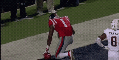 Man Leaning Against Danger Sign GIF