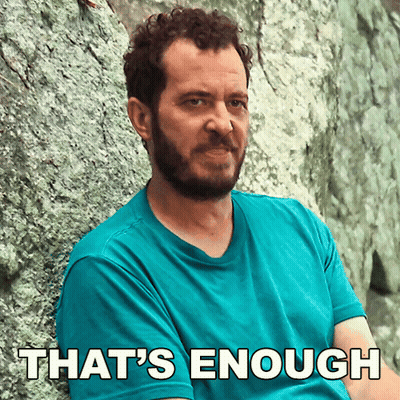 Man Leaning Against Rock Saying That's Enough GIF