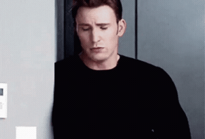 Man Leaning Against Wall GIF