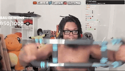 Man Lifting Barbell in Front of Bau Demons Screen