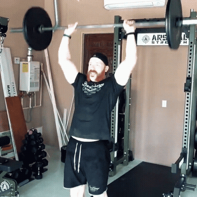 Man Lifting Barbell Near ARS Sign GIF