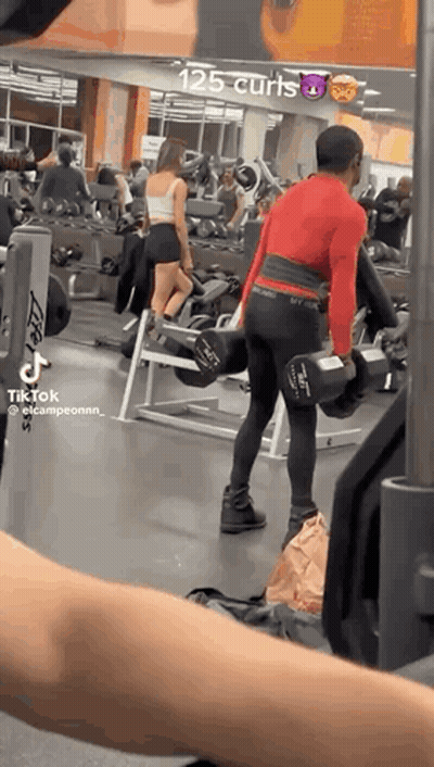 Man Lifting Dumbbell In Gym GIF