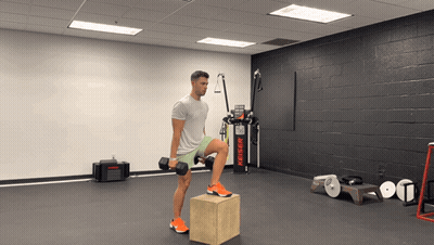 Man Lifting Dumbbell On Box In Gym GIF