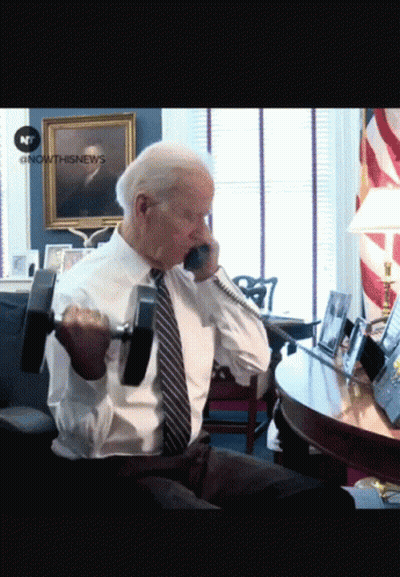Man Lifting Dumbbell Talking On Phone GIF