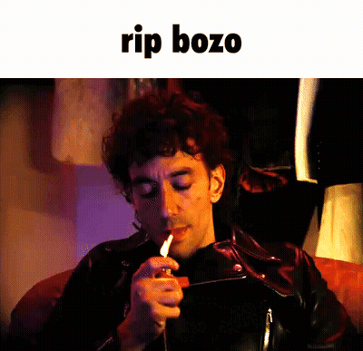 Man Lighting Cigarette With Rip Bozo GIF