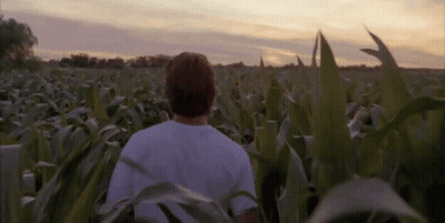 Man Loading Clothes Into Washing Machine Labeled Please Do Not Overfill GIF