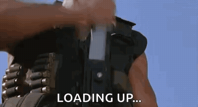 Man Loading Gun Saying Loading Up GIF