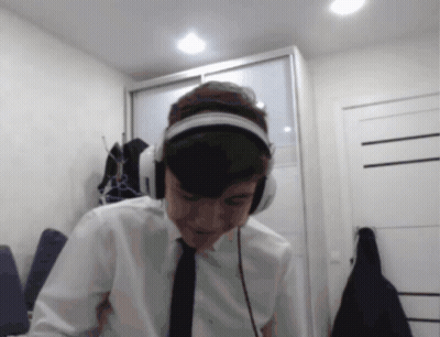 Man Looking At Camera With Headphones And Tie GIF