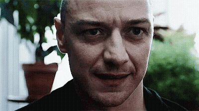 Man Looking At Camera With Plant GIF