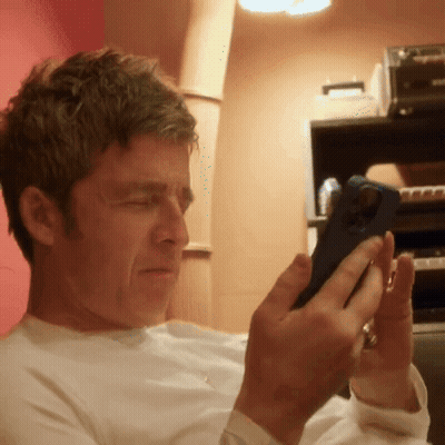 Man Looking At Cell Phone With Ring GIF