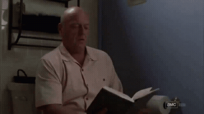 Man Looking At Paper With Eyes Closed GIF