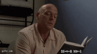 Man Looking At Paper With Giflr Watermark GIF