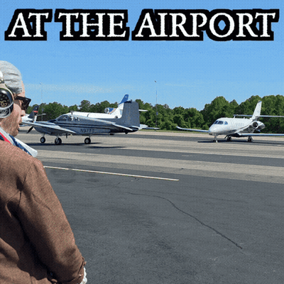 Man Looking At Plane At Airport GIF