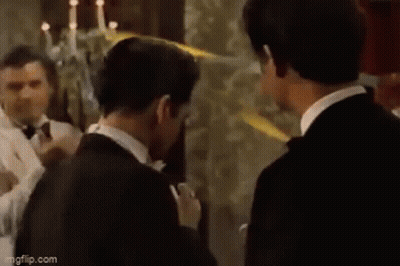 Man Looking At Reflection Holding Lighter GIF