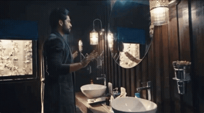 Man Looking At Reflection In Bathroom Mirror GIF