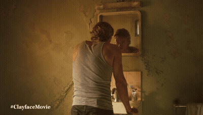Man Looking At Reflection In Mirror #Clayfacemovie GIF
