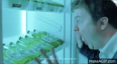 Man Looking Into Refrigerator With Sprite GIF