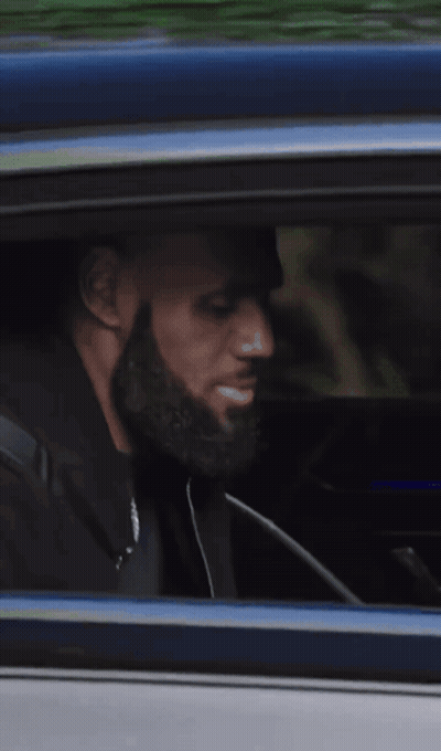 Man Looking Out Car Window While Driving GIF