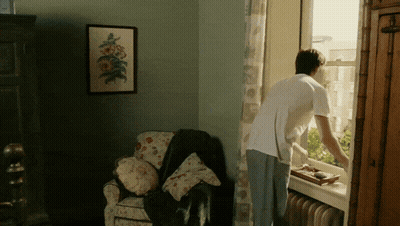 Man Looking Out Window GIF