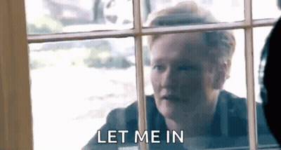 Man Looking Out Window Saying Let Me In