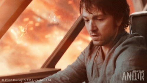 Man Looking Out Window With Andor GIF