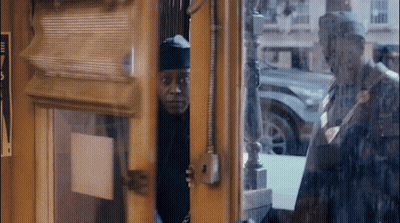 Man Looking Out Window With Free Sign GIF