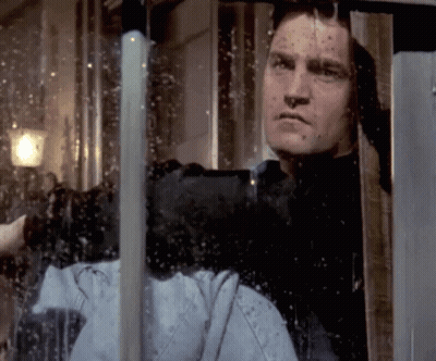 Man Looking Out Window With Reflection GIF