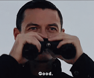 Man Looking Through Binoculars