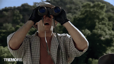 Man Looking Through Binoculars Tremors GIF
