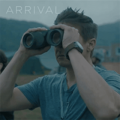Man Looking Through Binoculars With Arrival GIF