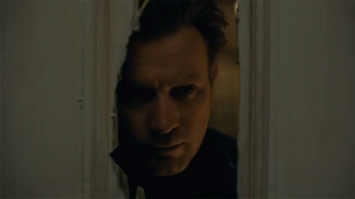 Man Looking Through Door Hole GIF
