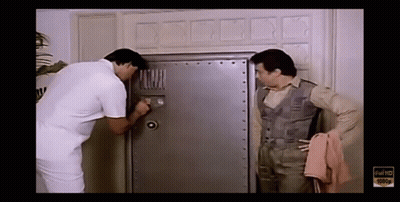 Man Looking Through Keyhole With Netflix Logo GIF