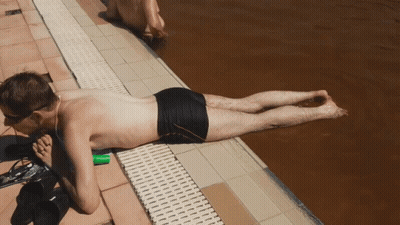 Man Lying By Pool GIF