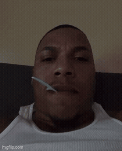 Man Lying Down With Spoon In Mouth GIF