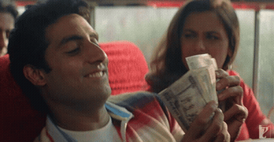 Man Lying Down Woman Holding Money GIF