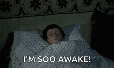 Man Lying In Bed Eyes Closed Saying I'm Soo Awake GIF