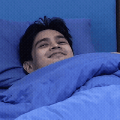 Man Lying In Bed With Blue Comforter GIF