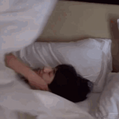 Man Lying In Bed With Pillow On Face GIF