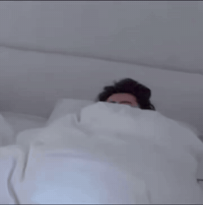 Man Lying In Bed With White Blanket GIF
