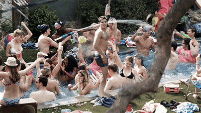 Man Lying In Pool With Champagne GIF