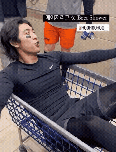 Man Lying In Shopping Cart With Beer Shower Sign GIF