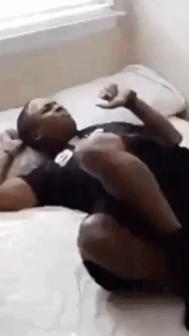Man Lying On Bed Crossed Legs GIF
