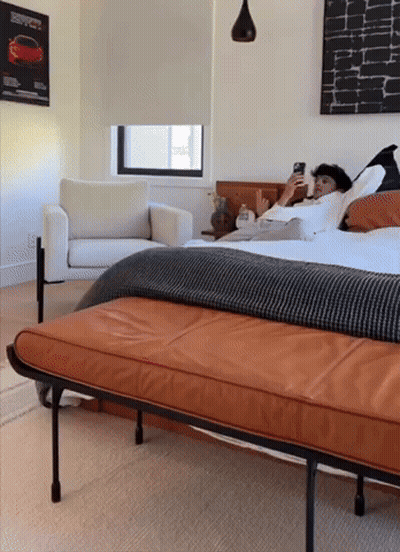Man Lying On Bed Looking At Cell Phone GIF