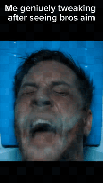 Man Lying On Blue Blanket With Eyes Closed GIF