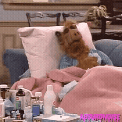 Man Lying On Couch With Ice Pack GIF