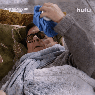 Man Lying On Couch With Ice Pack GIF