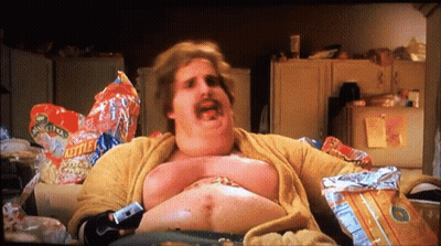 Man Lying On Couch With Kettle Corn GIF