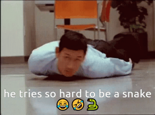 Man Lying On Floor With He Tries So Hard To Be Snake GIF