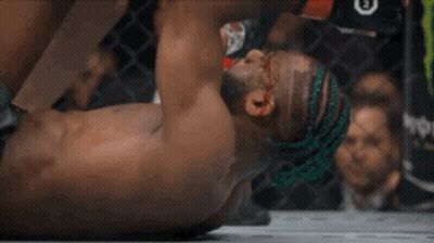 Man Lying On Ground With Letter E On Head GIF