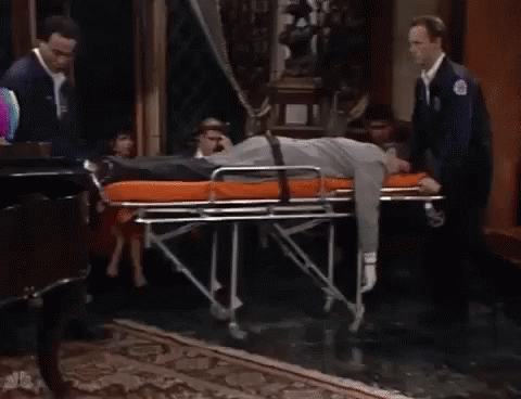 Man Lying On Stretcher In Living Room GIF